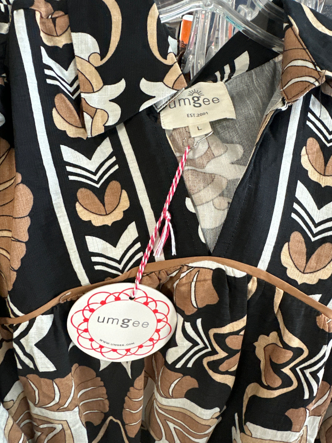 black, brown, mocha stylized floral print in a easy flowing dress with 3/4 sleeves