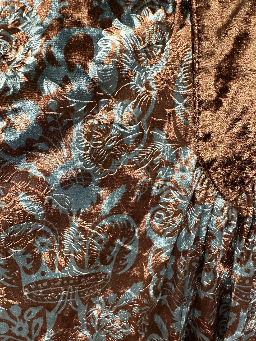 Long sleeved V neck top with brown placket and a teal and brown printed top