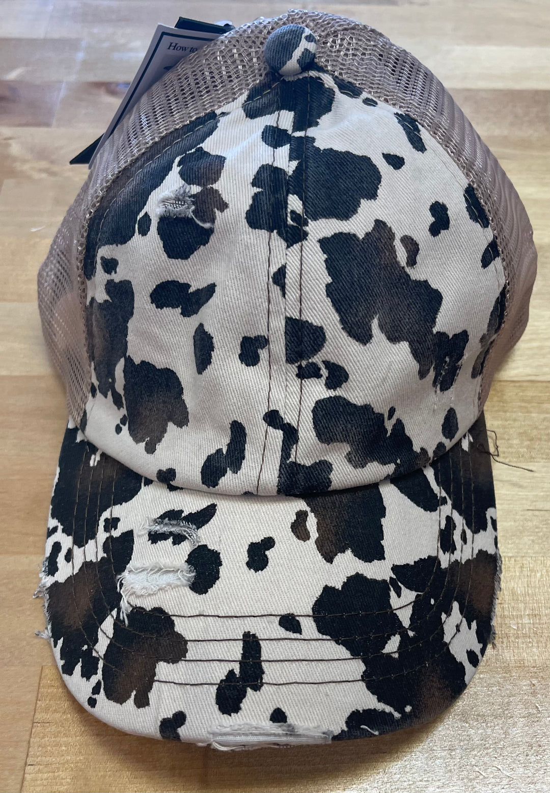 Cowprint distressed trucker hat